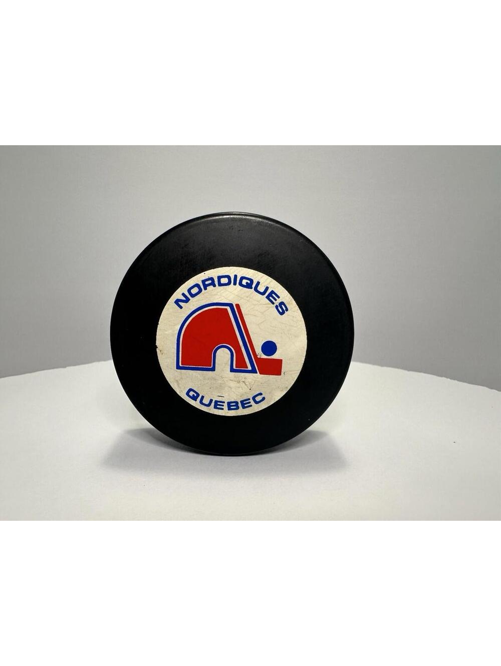 AUTHENTIC QUEBEC NORDIQUES NHL VINTAGE TRENCH MFG. OFFICIAL HOCKEY PUCK